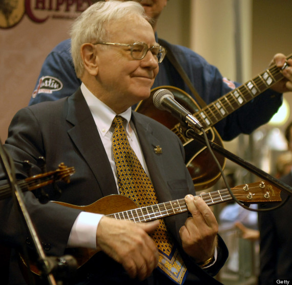 UNITED STATES - MAY 05: Berkshire Hathaway Inc. Chairman Warren Buffett plays with a blue grass band at the Qwest Center in Omaha, Nebraska, just before the start of the Berkshire Hathaway annual meeting, Saturday, May 5, 2007. Berkshire Hathaway said first-quarter profit rose 12 percent as its catastrophe reinsurance business benefited from higher prices and mild weather. (Photo by Chris Machian/Bloomberg via Getty Images)
